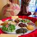 A traditional Ethiopian feast served in the traditional basket  table with honey wine.
Courtney Sacco I AnnArbor.com 